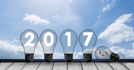 2017 inside light bulbs against a composite image 3D of blue sky