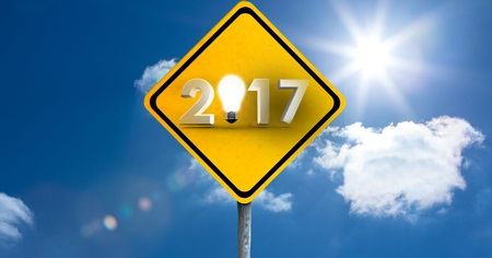 2017 road sign against a composite image 3D of clouds and blue skyの写真素材