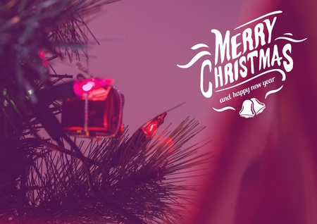 Digitally composite image of merry christmas message against red christmas decorationの写真素材