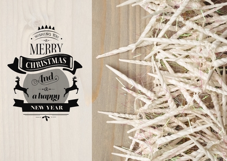 Digitally composite image of merry christmas and happy new year message with candles on wooden backgroundの写真素材