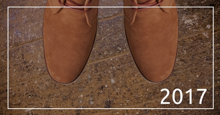 2017 new year wishes against brown chukka boots in background