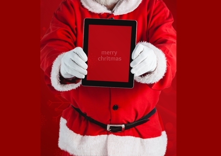 Mid section of santa claus holding a digital tablet with text marry xmassの写真素材