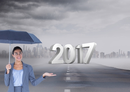 2017 against composite image of woman holding an umbrella on road in city