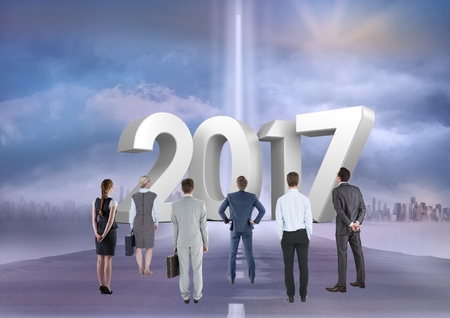 Composite image of 3D 2017 with business people on road to success against blue sky