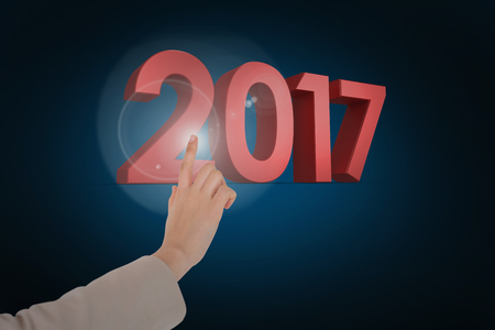 Businesswoman pointing against blue background with vignetteの写真素材