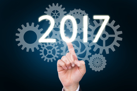 Hand of businessman in suit gesturing against blue background with vignetteの写真素材