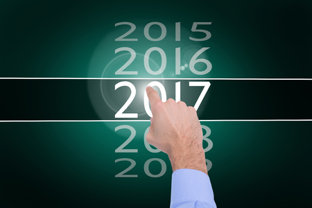Businessman hand pointing something  against green background with vignette