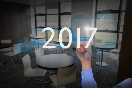 Businessman hand pointing something up against college