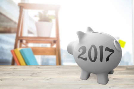Digital image of new year 2017 against view of business stuffs on scale