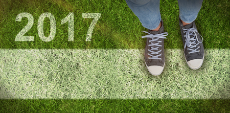 Casual shoes against closed up view of grassの写真素材