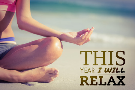 this year i will relax against close up view of fit woman doing yoga beside sea