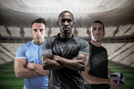 3D Rugby players against football stadiumの写真素材