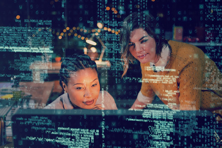 Women looking at computer in office 3Dの写真素材