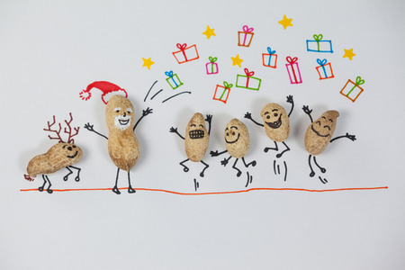 Conceptual image of figurine of santa giving christmas giftの写真素材