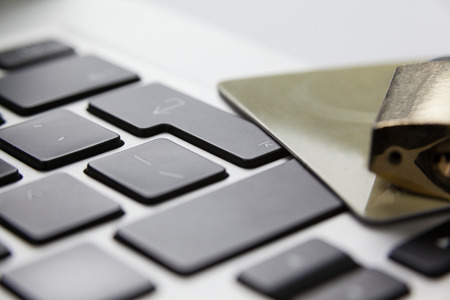 Close-up of metallic lock with smart card on laptopの写真素材