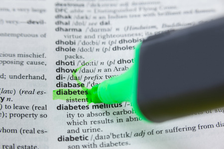Close-up of highlighted word diabetes in dictionaryの写真素材