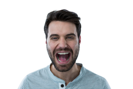 Man screaming against white backgroundの写真素材