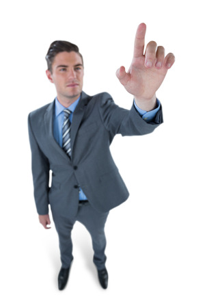 Businessman using digital screen against white backgroundの写真素材
