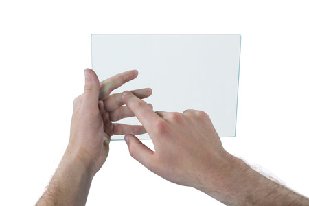 Man using futuristic digital tablet against white backgroundの写真素材