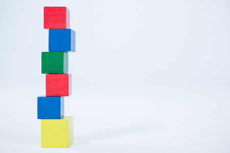 Stack of building blocks on white background