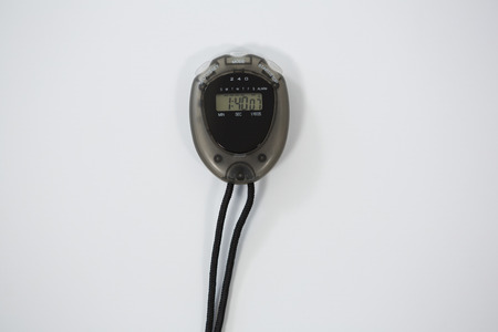 Close-up of stopwatch on white background