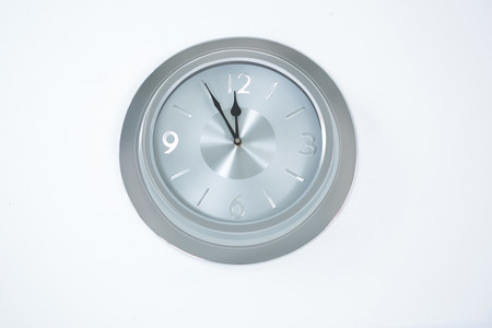 Image of countdown to midnight on clock on white background