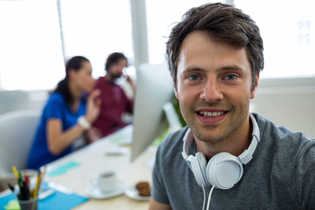 Portrait of smiling business executive in office
