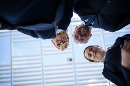 Portrait of smiling businesspeople looking downの写真素材