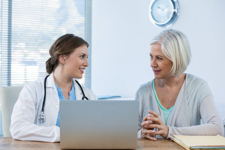 Doctor interacting with patient in clinic