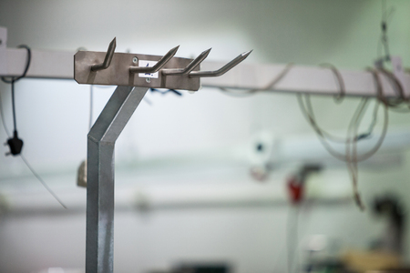 Close-up of empty hook at meat factoryの写真素材