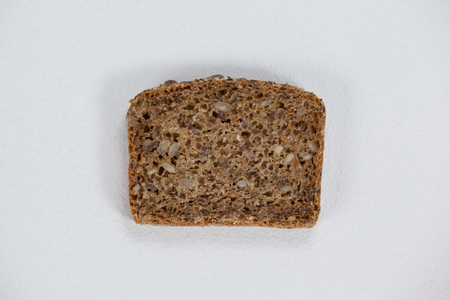 Close-up of a bread slice on white backgroundの写真素材
