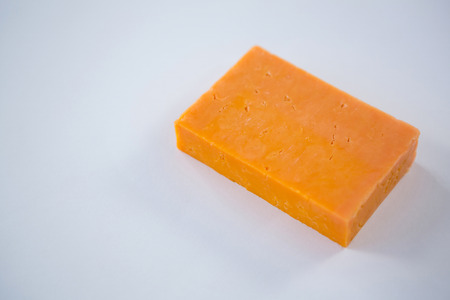 Close-up of cheese block on white backgroundの写真素材