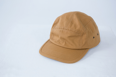Close-up of brown cap on white background