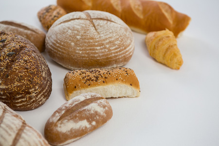 Different types of bread on white backgroundの写真素材