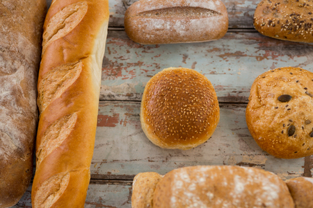 Close-up of different types of bread on wooden surface