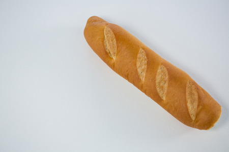 Close-up of baguette loaf on white backgroundの写真素材