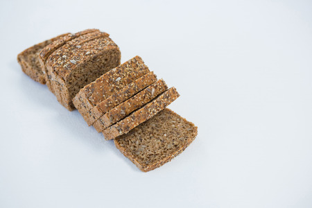 Close-up of sliced bread on white backgroundの写真素材