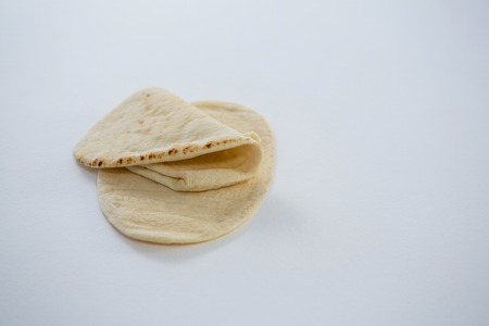 Two flat breads on white backgroundの写真素材