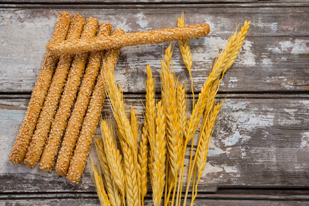 Close-up of bread sticks on wooden table