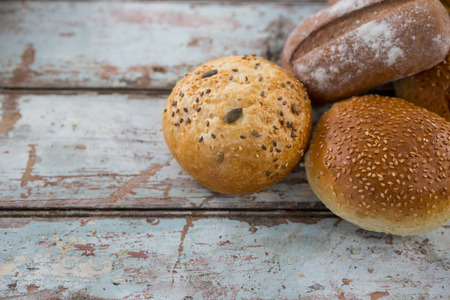 Close-up of bread loaves on wooden table