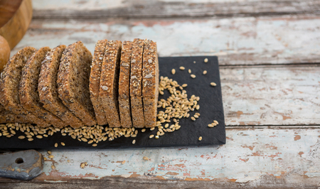 Close-up of bread slices on wooden table