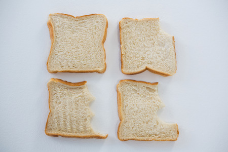 Close-up of bread slices on white backgroundの写真素材