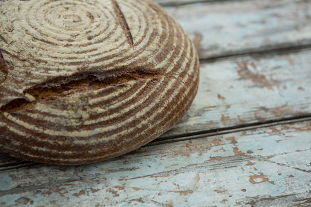 Close-up of bread loaf on wooden table