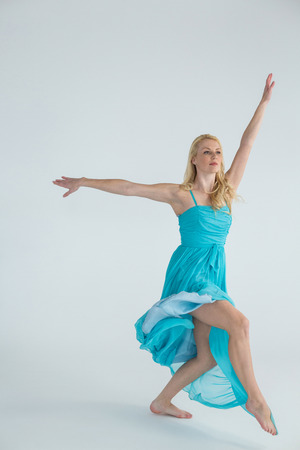Dancer practicing contemporary dance in dance studioの写真素材