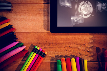Technology interface  against digital tablet with various stationery with copy spaceの写真素材