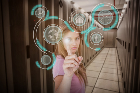 Pretty blonde pointing something with her finger against data center