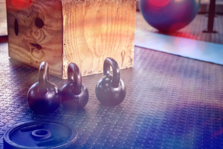 Kettlebells and wooden block at crossfit gymの写真素材