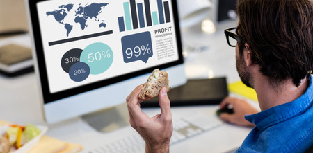 Computer graphic image of business presentation against high angle view of man working on computerの写真素材