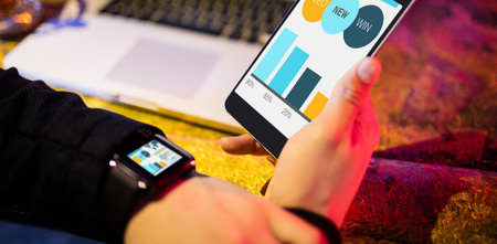 Computer graphic image of business presentation with charts and text against businessman with various technologiesの写真素材