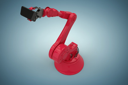 High angle view of red robot holding smart phone against grey vignette 3dの写真素材